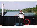 Howard on small cable car ferry crossing Saint Patrick's channel-Little Narrows, Cape Breton, Nova Scotia, Canada
