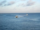 Rescue fishing charter boats coming at high speed