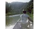 Canoe boatman on trip up river to falls