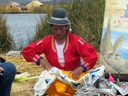 Uros lady showing her embroidery