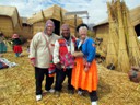 Howard and Pat in traditional Uros clothing (solar panel in background)